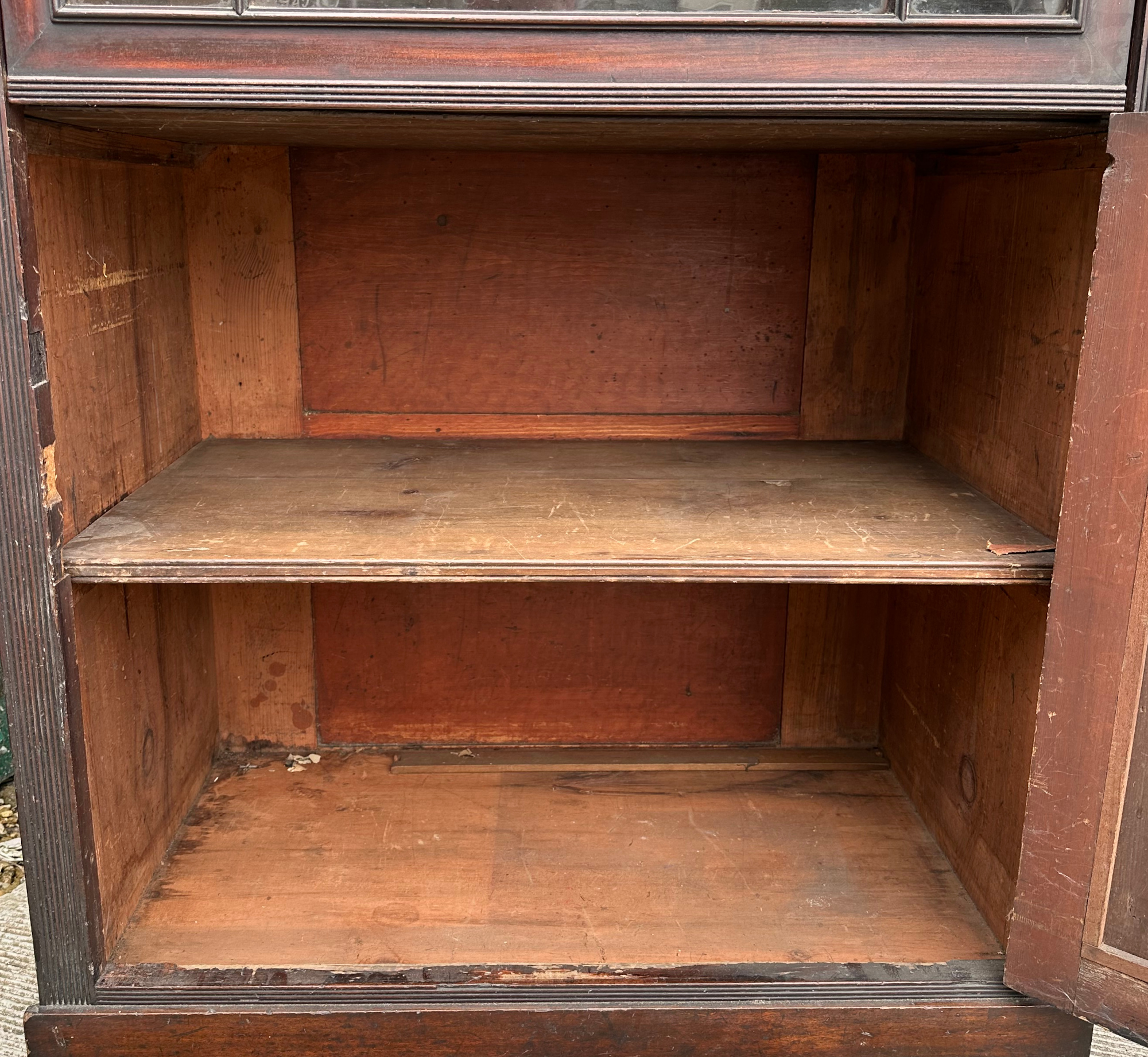 A 19th century mahogany glazed book case on cupboard, having a moulded cornice above an astragal - Image 5 of 7