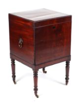 A Regency mahogany teapoy with ebony stringing, the lift-up top revealing a fitted interior of three