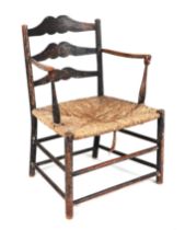 An Arts and Craft pass chair in the style of Ernest Gimson (1864-1919), made in ebonised ash with