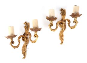 A pair of Rococo style gilt bronze twin arm wall lights, 24cm high. Condition Report Good overall