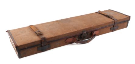 A canvas and leather trimmed gun case, 83cm wide.