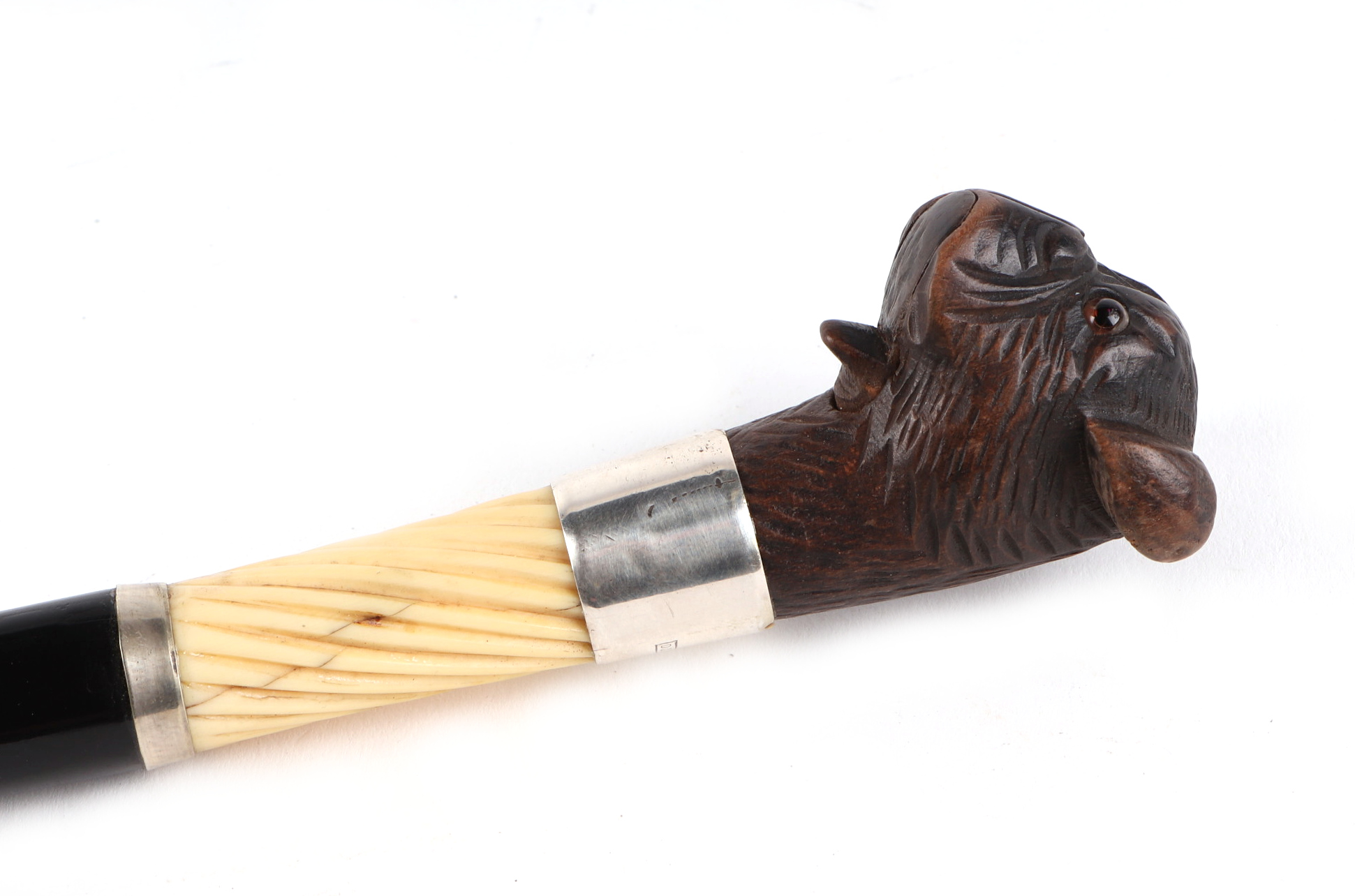 A Victorian ebonised walking cane, with silver collar and ivory section, having a carved soft wood - Image 4 of 5