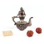 A Chinese / Tibetan copper and white metal teapot, 13cm high; a pair of decorative walnuts and a
