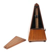 A late 19th century walnut French metronome, 23cm high.