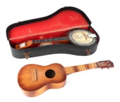 A Swanee banjo ukulele, cased, 53cm long, with modern guitar shaped ukulele (2).