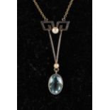 An Edwardian yellow metal mounted aquamarine and seed pearl pendant necklace, 3g.