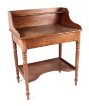 A Victorian mahogany washstand with three-quarter gallery, on turned legs joined by a undertray,