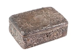 A late Victorian silver jewellery box, profusely embossed with folate scrolls and having a blank
