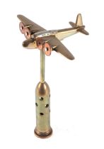 A trench art cast brass model of a Southerland aircraft, mounted on a brass plinth, wingspan 16cm.