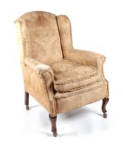 A Victorian upholstered wingback armchair, together with a Lloyd Loom style painted wicker chair (