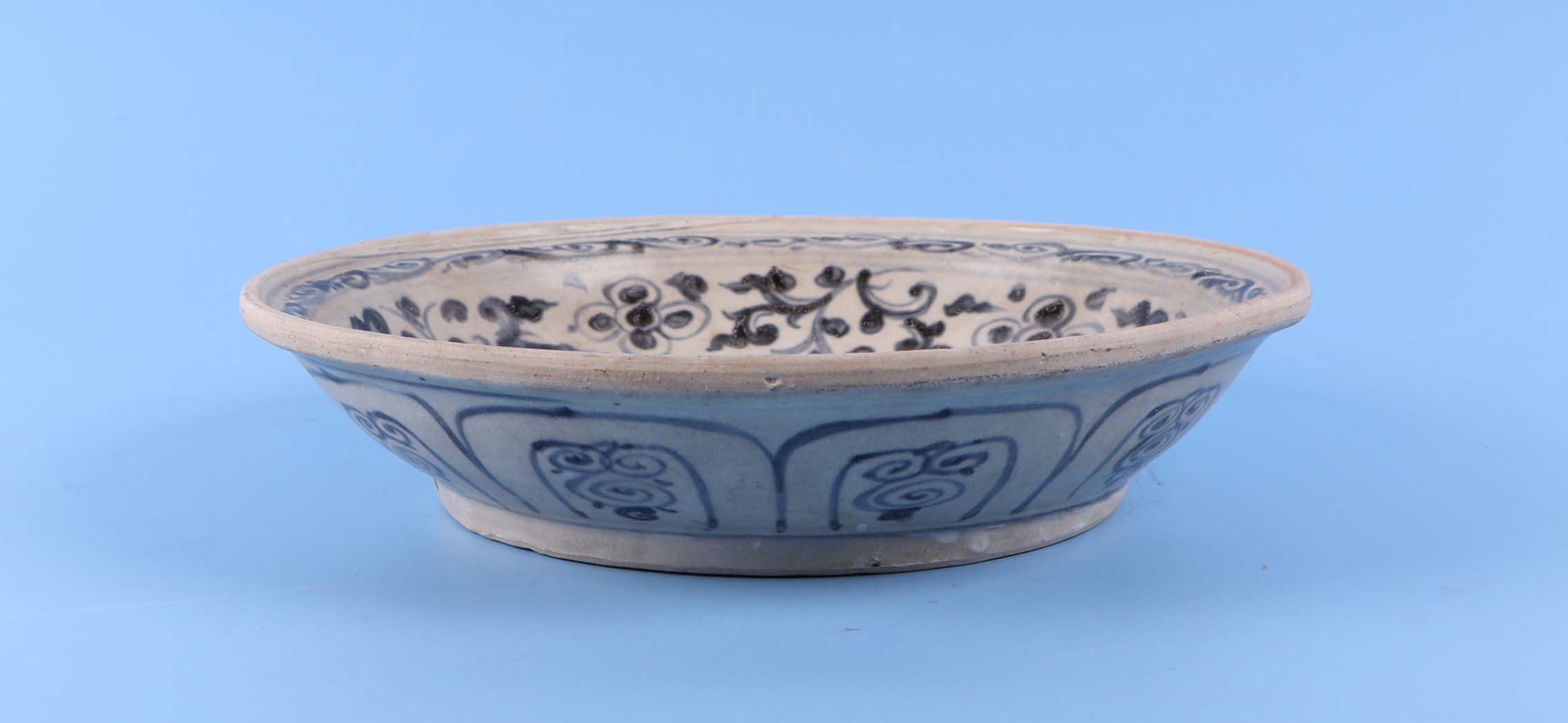 A Vietnamese Anamese blue and white shallow pottery bowl decorated with flowers, 26cm diameter. - Image 2 of 4