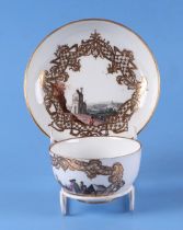 An 18th century Meissen cabinet cup and saucer decorated with scenes of figures on a foreshore