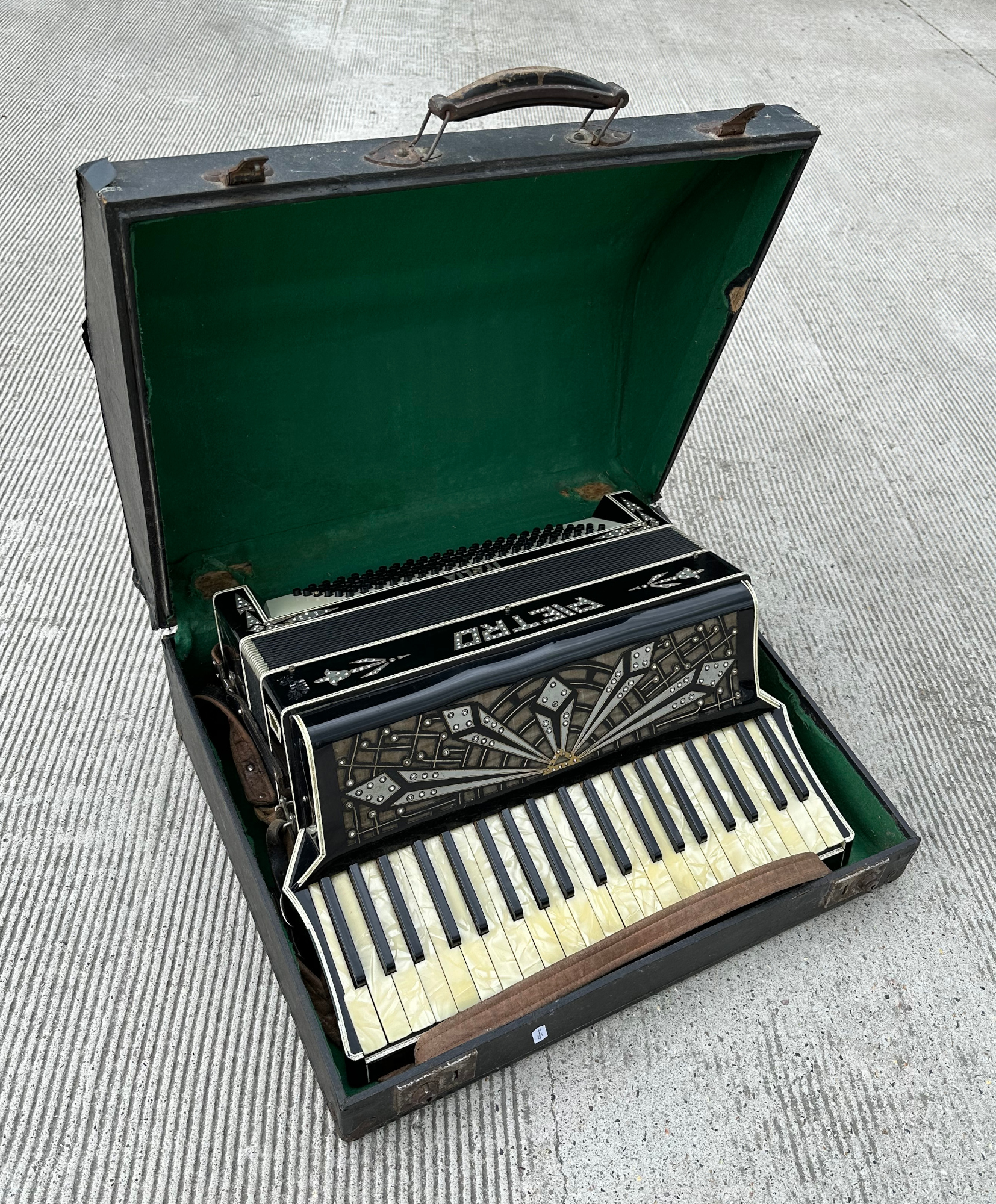 A Pietro piano accordion, cased.