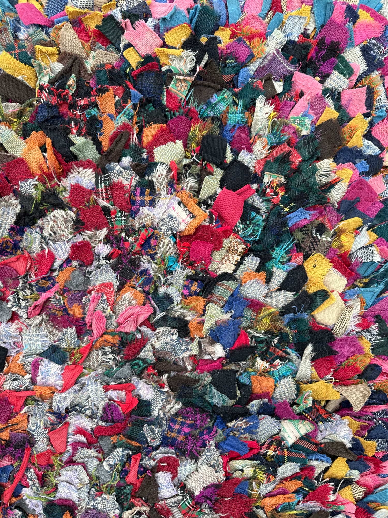 An early 20th century rag rug, 130 by 95cm. - Image 2 of 3