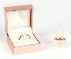 A silver gilt dress ring, set with five pink stones, together with another dress ring (2).