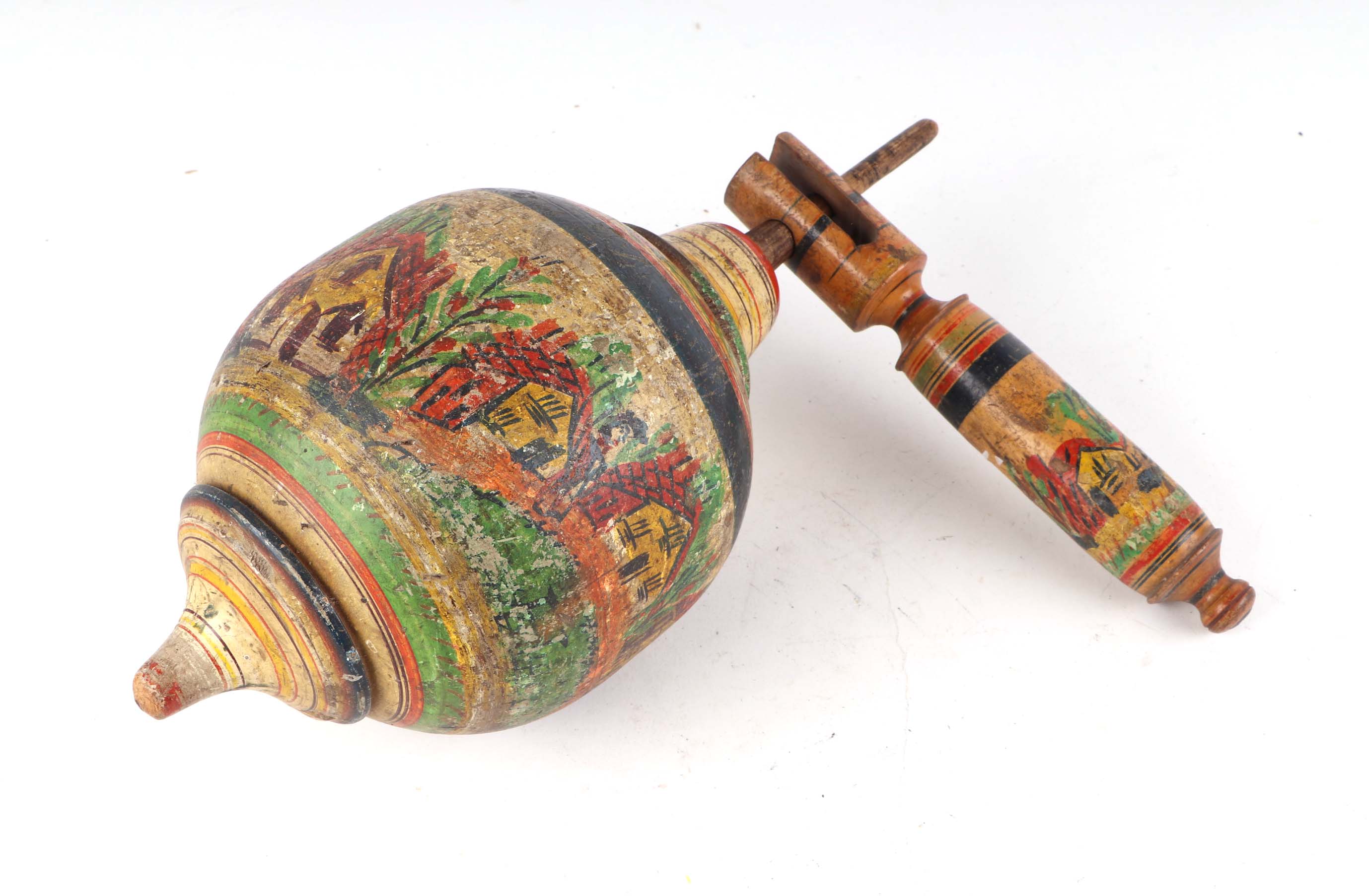 A turned wooden painted folk art spinning top, 32cm high.