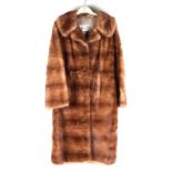 A Harry Musin Furs vintage Musquash three-quarter length fur coat.