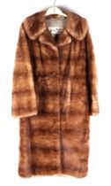 A Harry Musin Furs vintage Musquash three-quarter length fur coat.