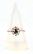 A 9ct gold diamond and sapphire cluster ring, approx UK size K, 1.4g.