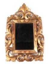 A Florentine style gilt wood mirror, 26cm wide, with rectangular plate, 13 by 17cm.