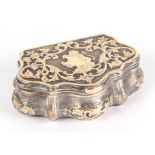 A 19th century Russian silver gilt and yellow metal snuff box, decorated foliate scrolls with