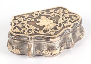 A 19th century Russian silver gilt and yellow metal snuff box, decorated foliate scrolls with