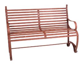 A iron strap work garden bench, with scroll arms and feet, and ball finials, 140cm high.