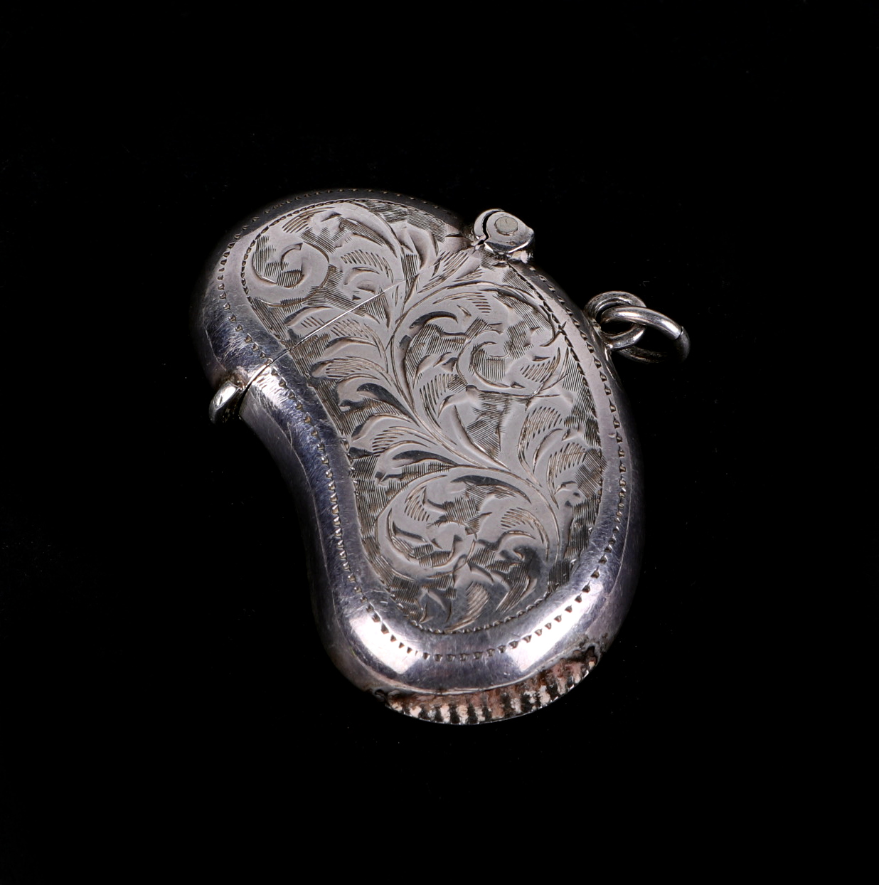 An Edwardian kidney shaped vesta case, with engraved decoration, initialled WGW, Birmingham 1905, - Image 2 of 3