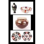A late 19th century Japanese satsuma hanging bowl, 23cm diameter, a group of Imari plates and bowls,