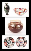 A late 19th century Japanese satsuma hanging bowl, 23cm diameter, a group of Imari plates and bowls,