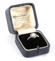 An 18ct white gold and platinum diamond and pearl ring, the head set with central pearl surround