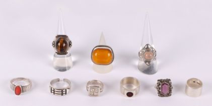 A silver and amber set dress ring; together with eight silver rings