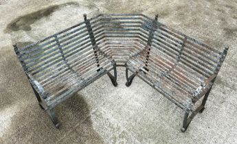 An impressive well weathered iron strapwork three-section corner bench, overall 160 by 160cm.