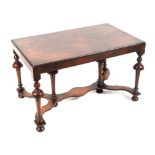 A William and Mary style walnut low side table on turned legs, joined by a shaped stretcher, 76cm