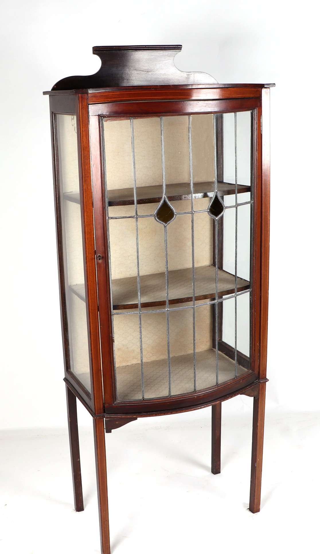 An Edwardian mahogany bowfront display cabinet, the leaded glass panelled door enclosing a shelved - Image 2 of 2