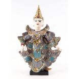 A Burmese painted wooden puppet on stand, 40cm high.