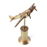 A trench art cast brass model of a Sterling bomber, mounted on a brass plinth, wingspan 23cm.