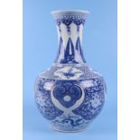 A large Chinese blue and white vase, decorated dragons and flowers, 38cm high. Condition Report Very