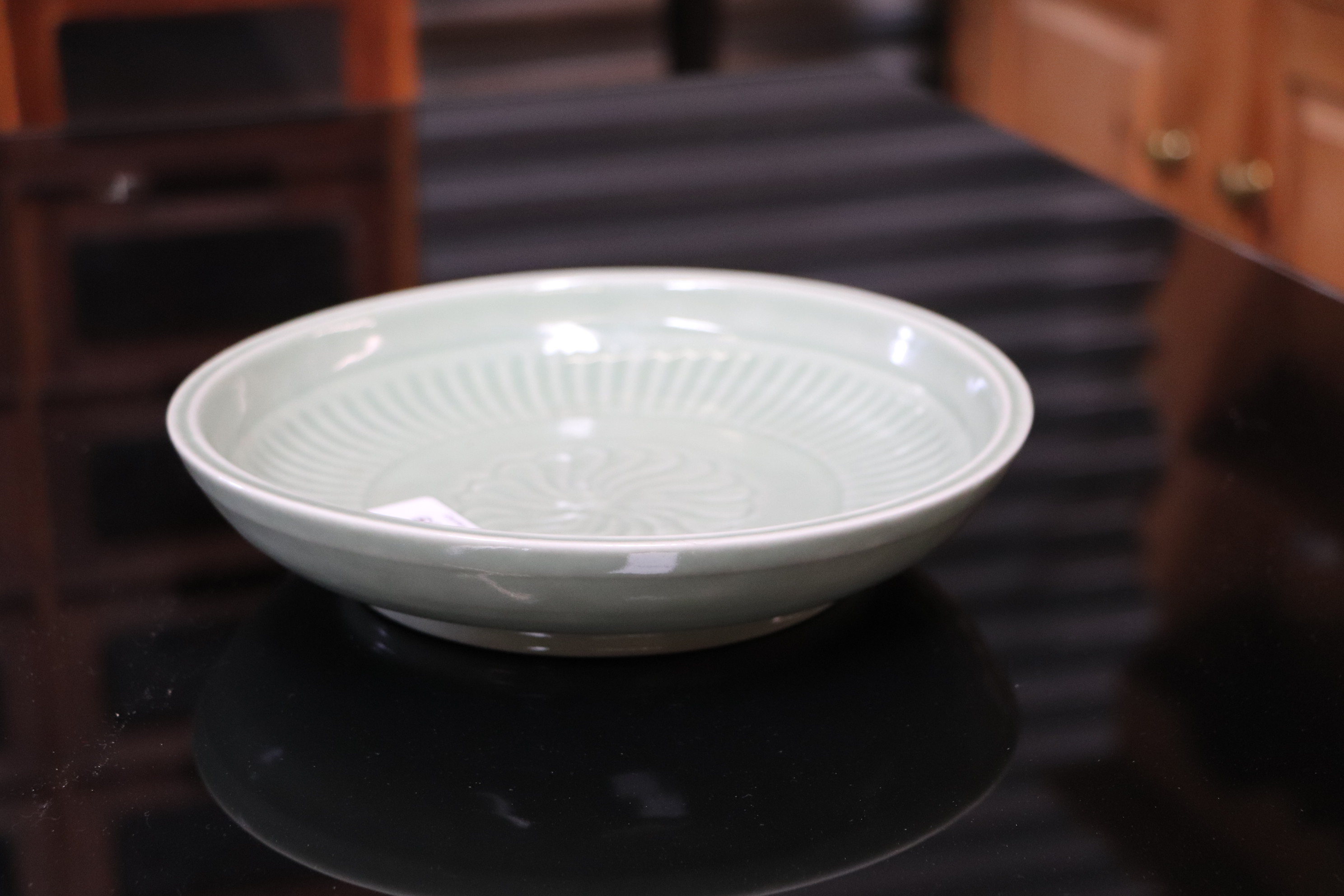 A Chinese celadon glaze shallow dish, with six character blue marks to the underside, 26cm diameter, - Image 7 of 10