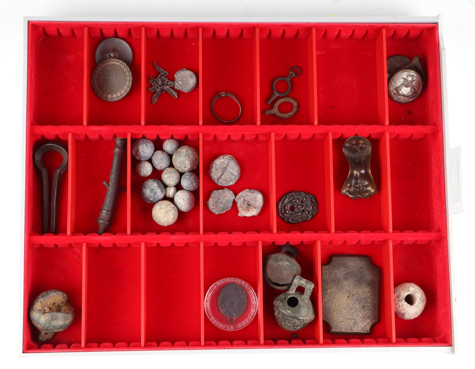 A group of metal detectorist finds, to include buttons and musket balls.