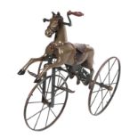 A 19th century French child's horse tricycle Velocipede, with a carved painted wooden body, cast