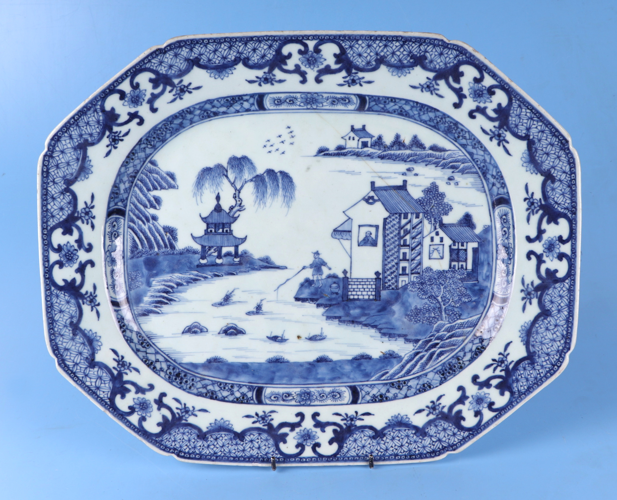 An 18th century Chinese blue & white shaped rectangular meat plate decorated a river scene with a - Image 2 of 12