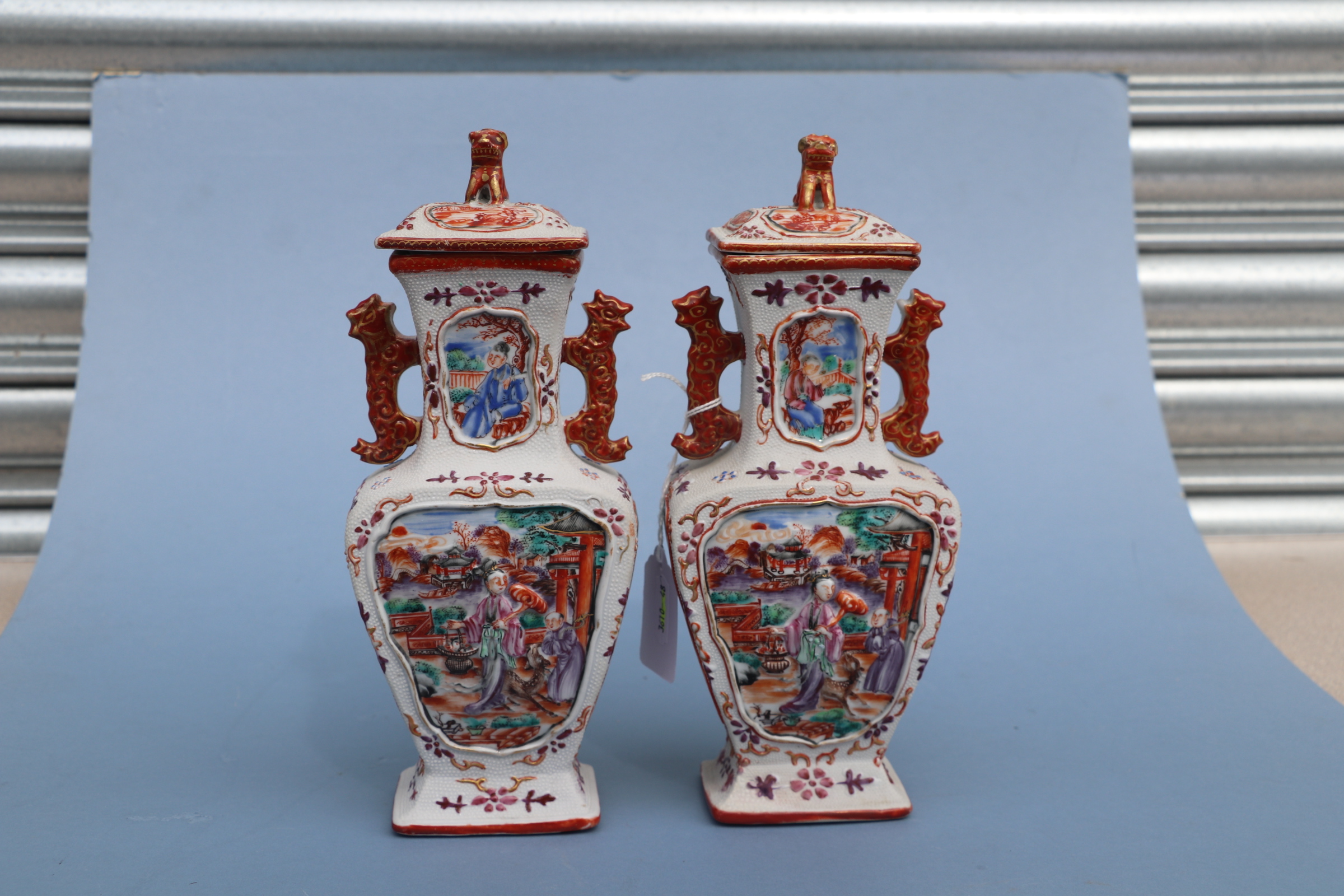 A pair of Chinese Mandarin palette famille rose Export vases and covers moulded in relief with - Image 21 of 25