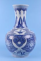 A large Chinese blue and white vase, decorated dragons and flowers, 38cm high. Condition Report Very