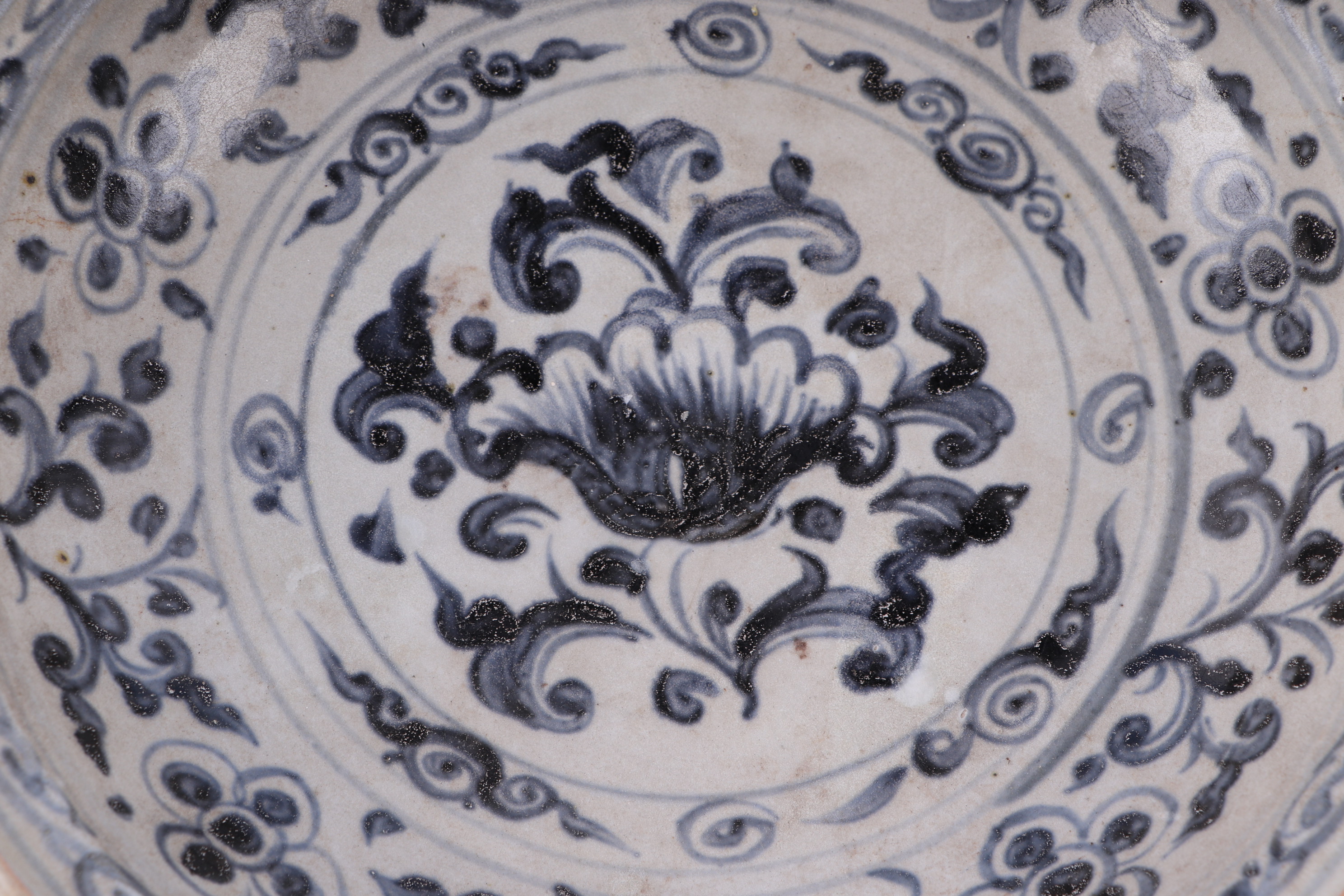 A Vietnamese Anamese blue and white shallow pottery bowl decorated with flowers, 26cm diameter. - Image 4 of 4