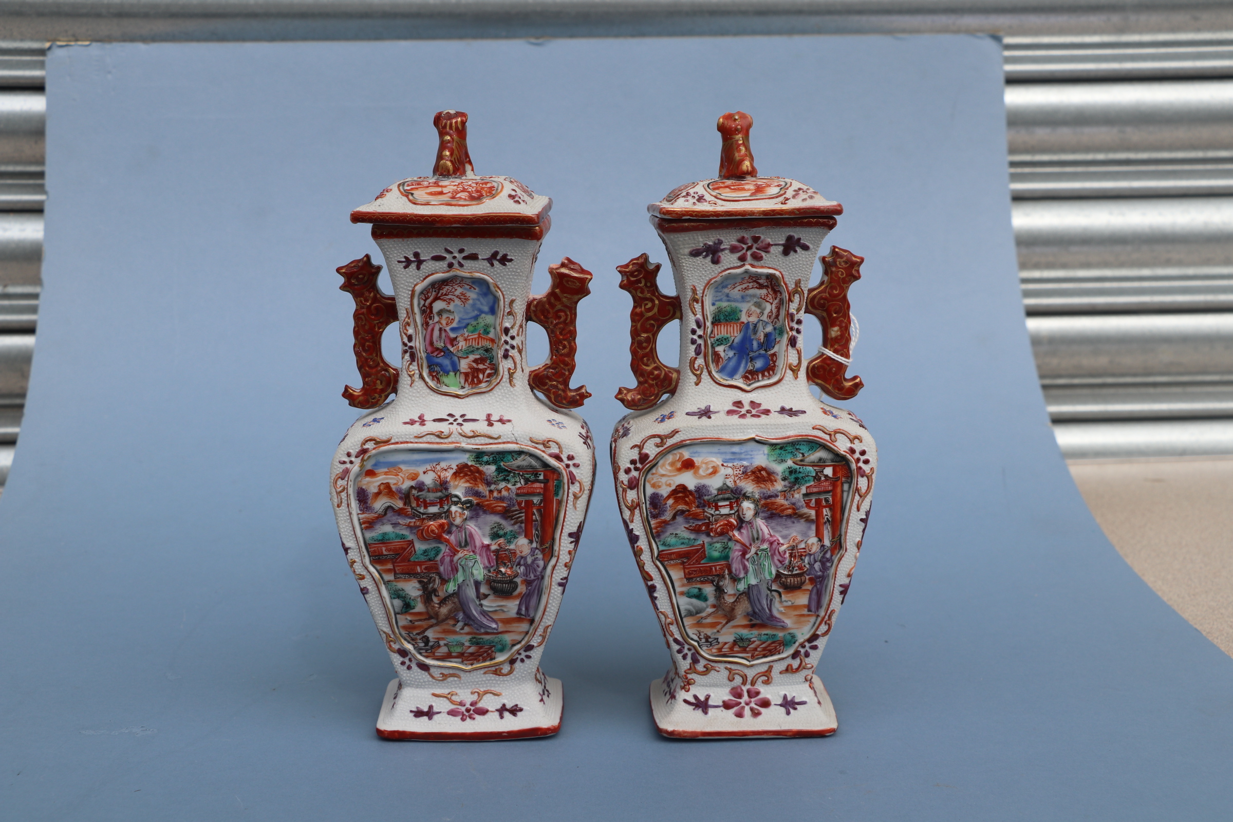 A pair of Chinese Mandarin palette famille rose Export vases and covers moulded in relief with - Image 19 of 25