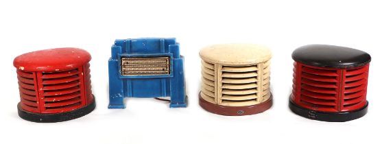 Three 1950s HMV Bakelite room heaters, each 32cm wide, and a blue enamel surround electric fire,