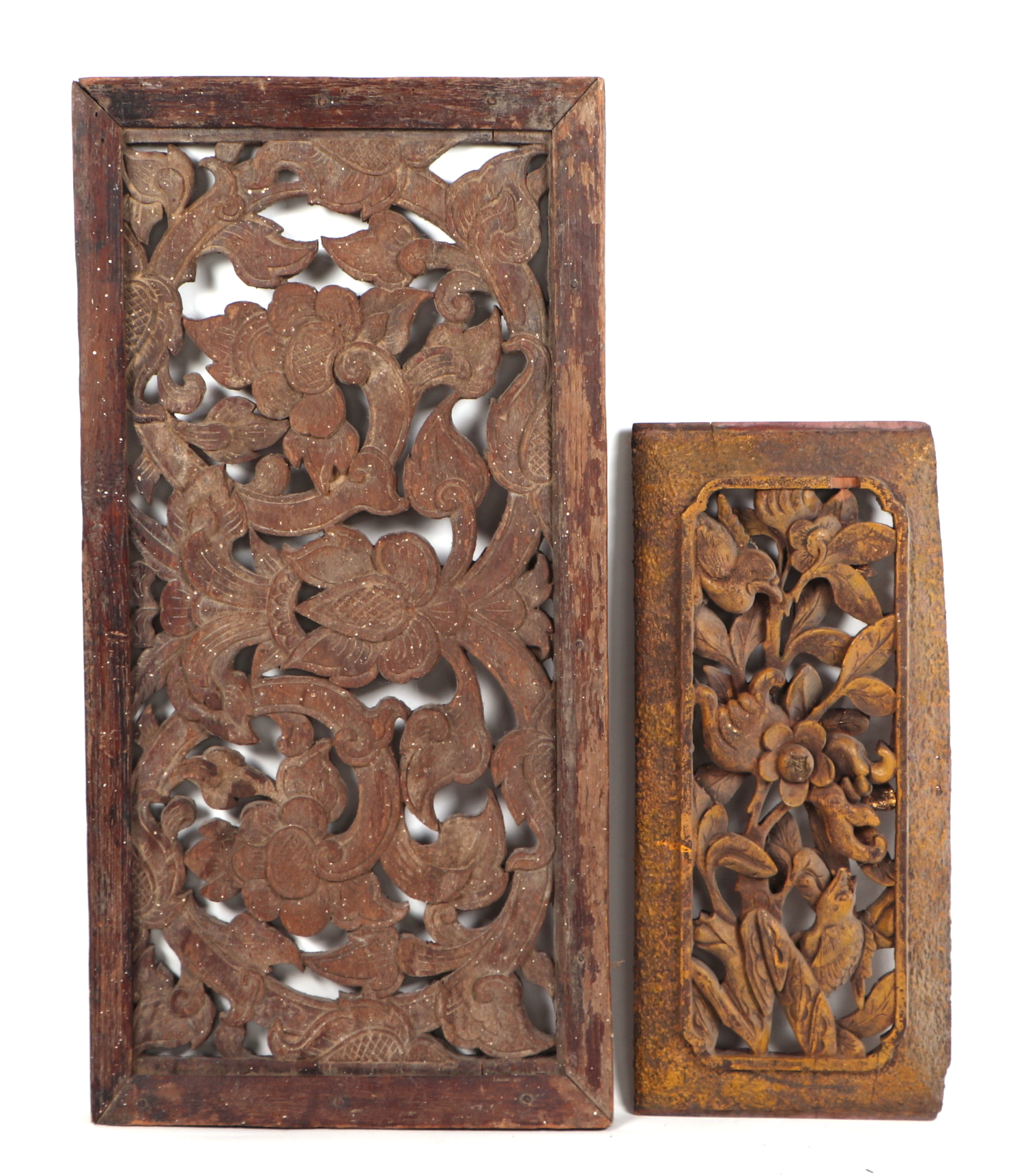 A pair of Burmese carved teak ventilation panels, having painted and gilded decoration, largest 77cm