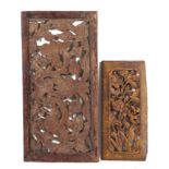 A pair of Burmese carved teak ventilation panels, having painted and gilded decoration, largest 77cm