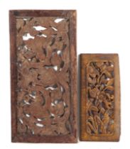 A pair of Burmese carved teak ventilation panels, having painted and gilded decoration, largest 77cm